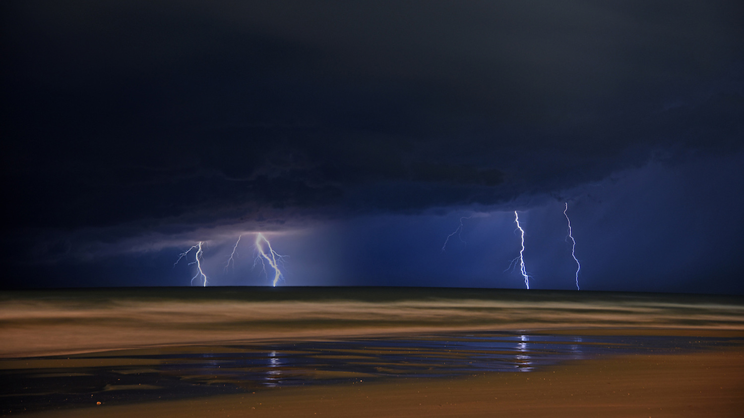 Lightning strikes the ocean horizon near Atlantic Beach, NC