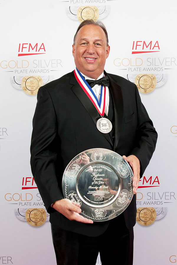 NC State's Randy Lait holding his Silver Plate award