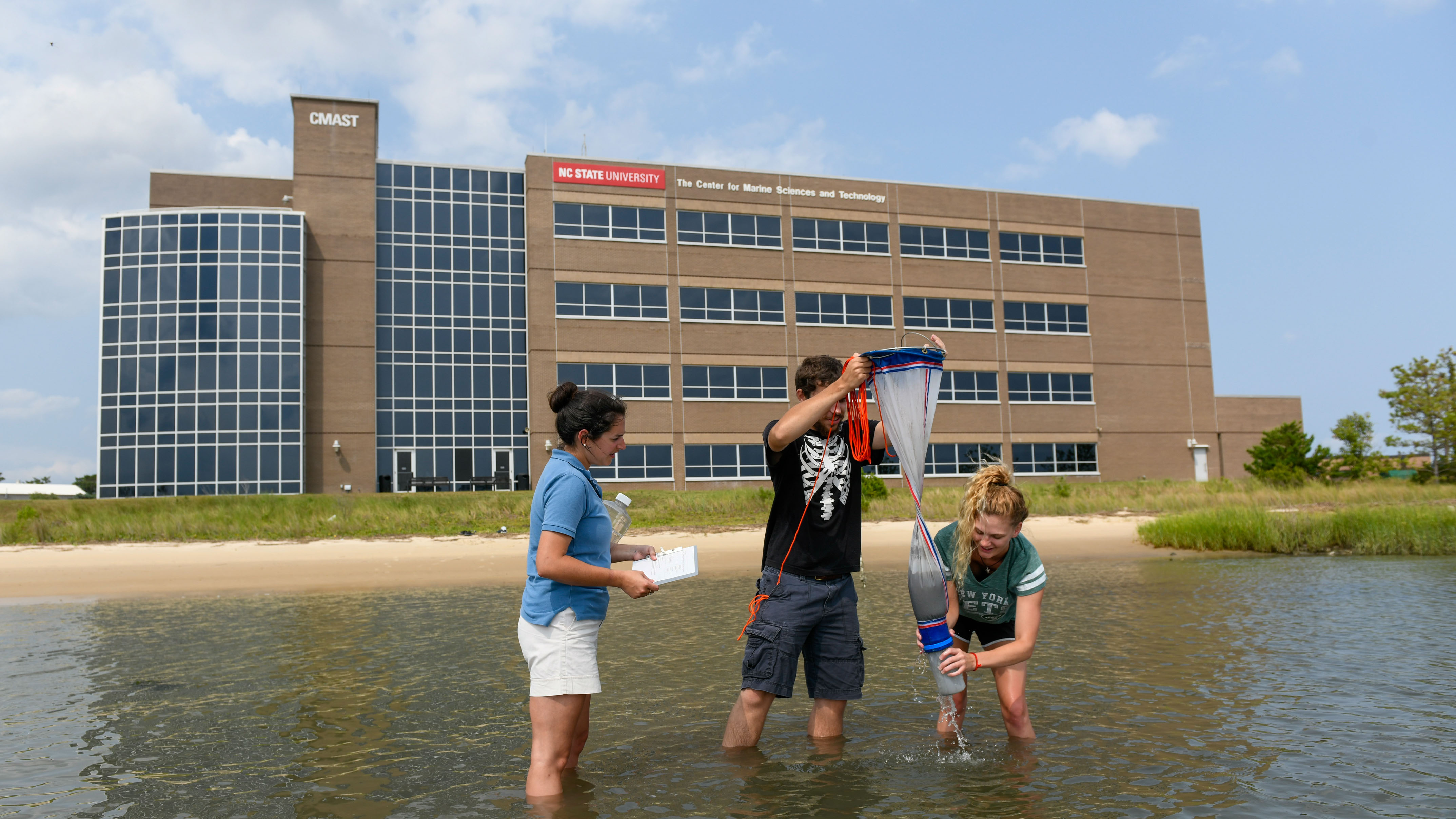 Students gather samples in the sound in front of the CMAST building