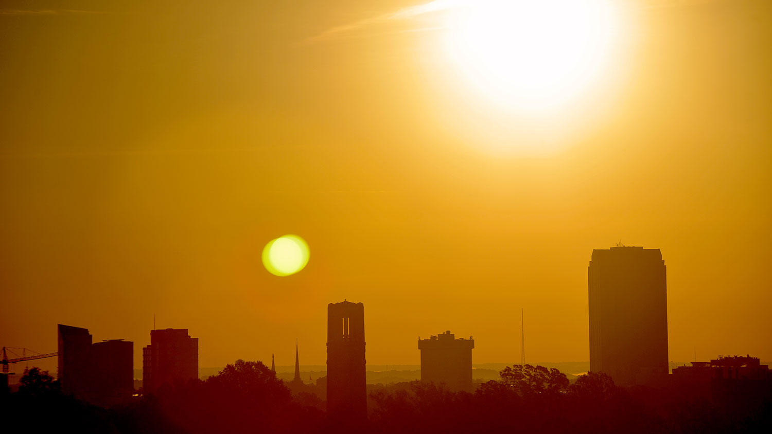 The sun over NC State's campus