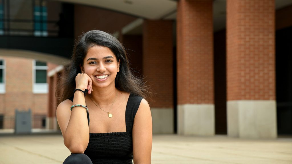 Incoming student Ritika Shamdasani sits on steps outside of Wilson College of Textiles.
