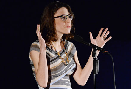 Vanessa Volpe speaks at a slam poetry event.