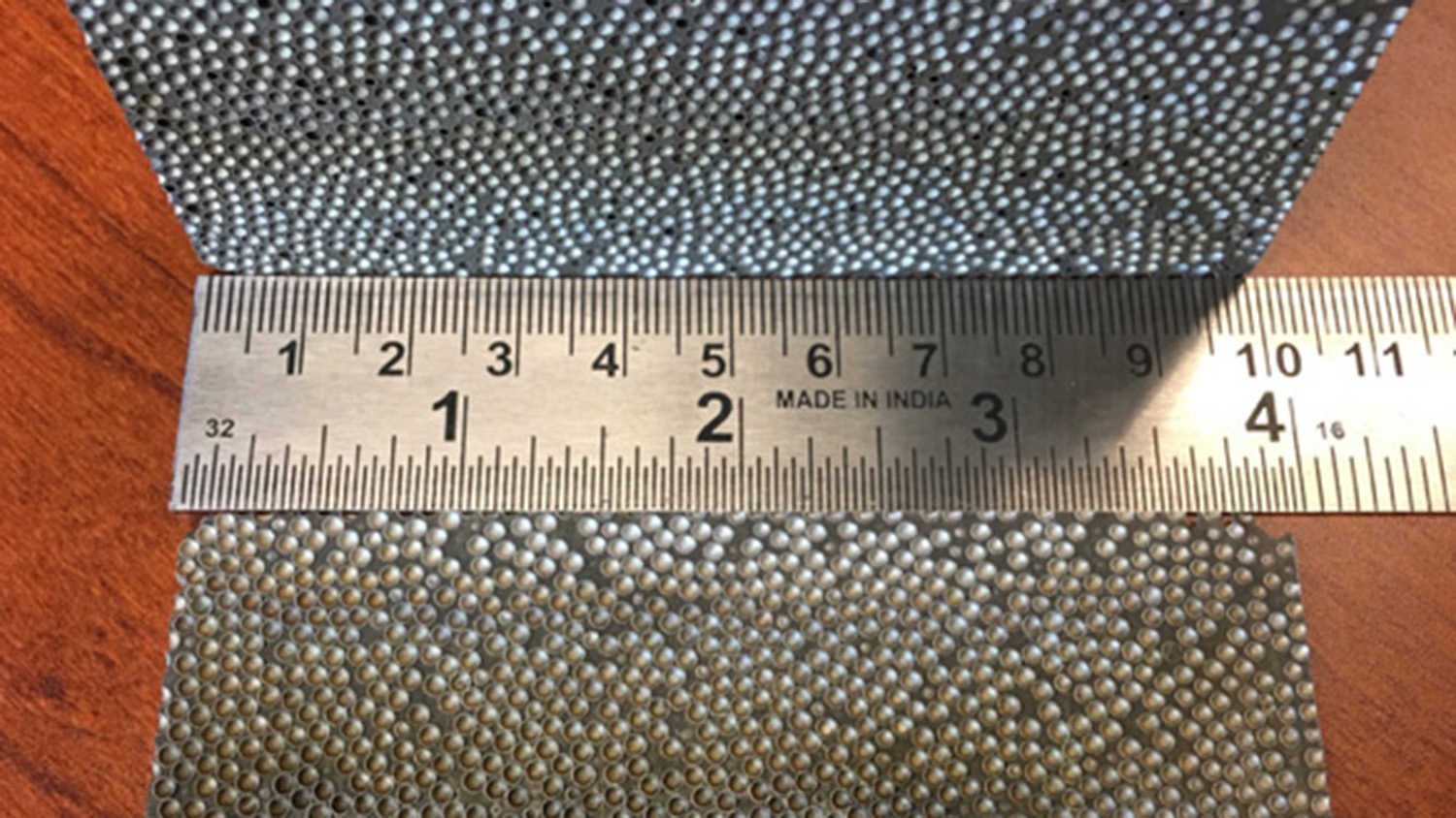 composite metal foam with a ruler for scale
