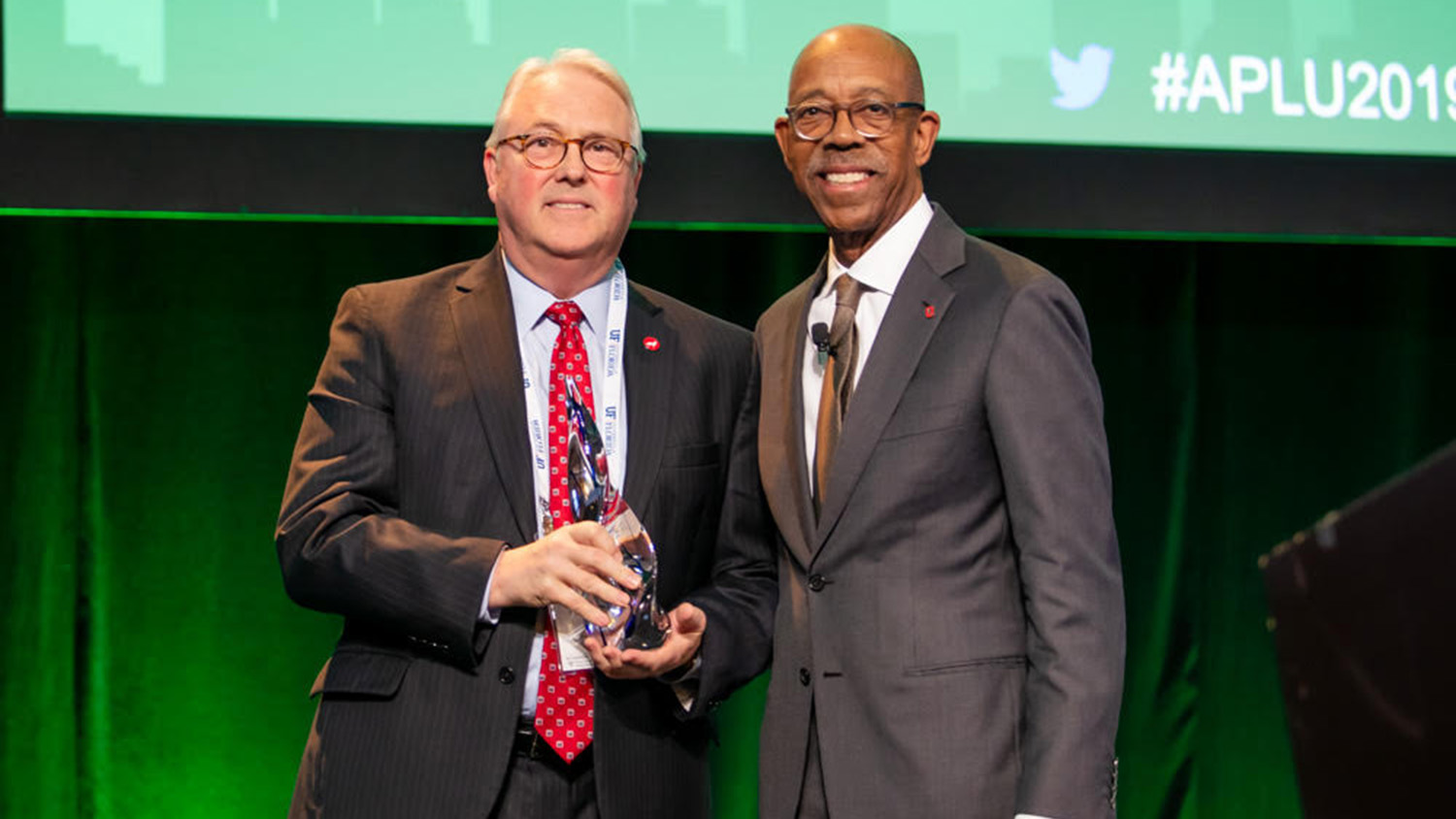 photo of Chancellor Woodson receiving award.