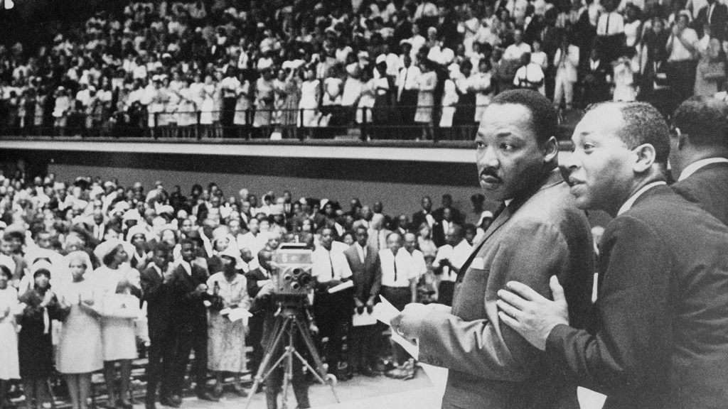 Martin Luther King Jr. prepares to go on stage at Reynolds Coliseum on July 31, 1966, in front of an integrated crowd of 5,000 and a UNC-TV audience. [Photo courtesy of the State Archives of North Carolina.]