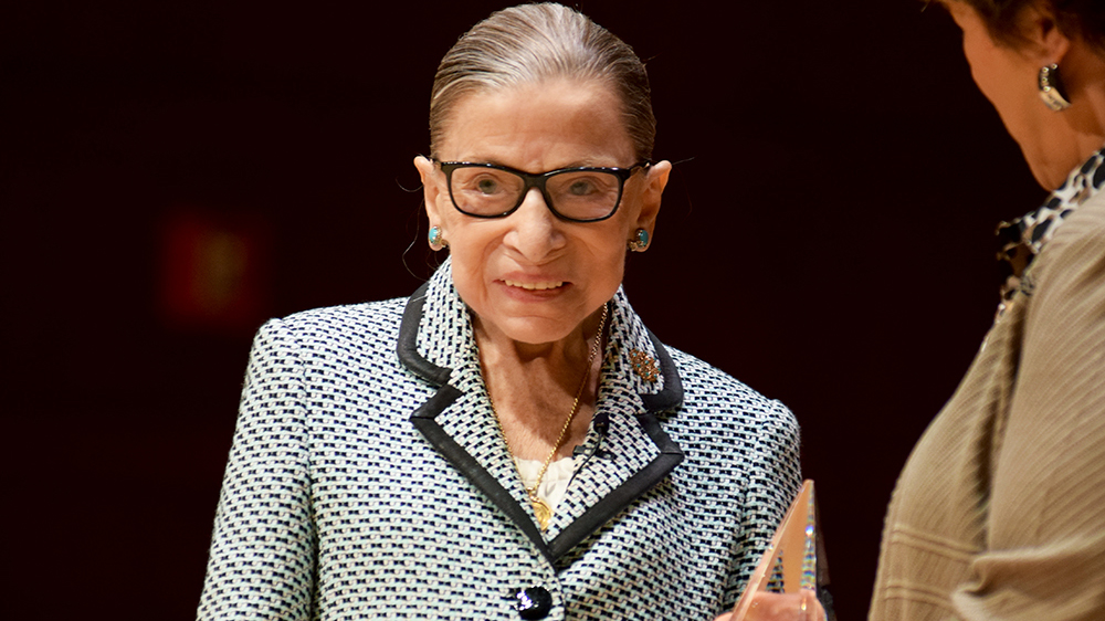 Supreme Court Justice Ruth Bader Ginsburg receives an award from Meredith College President Jo Allen