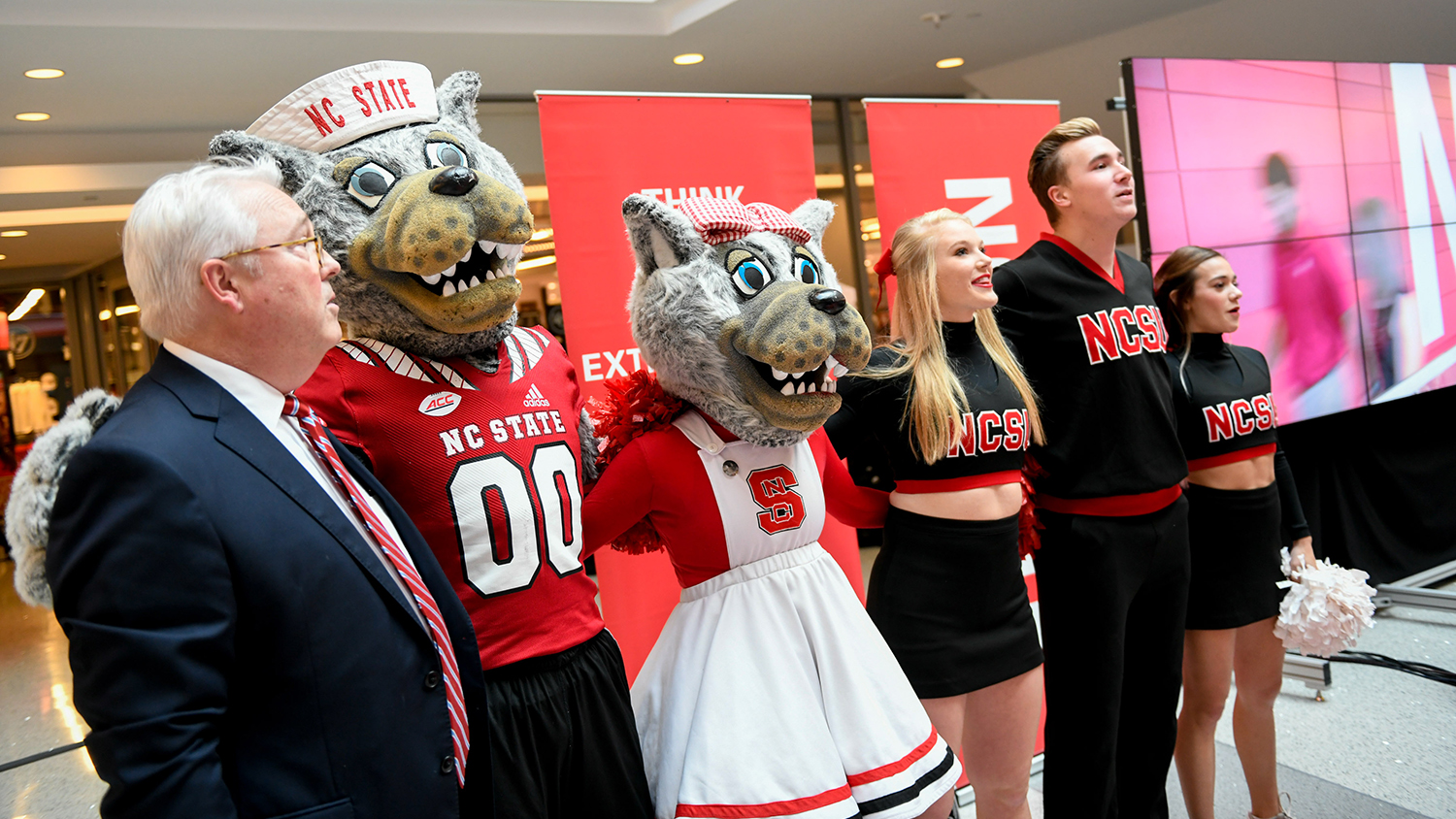 The chancellor sings the alma mater with mascots and students during fall address.