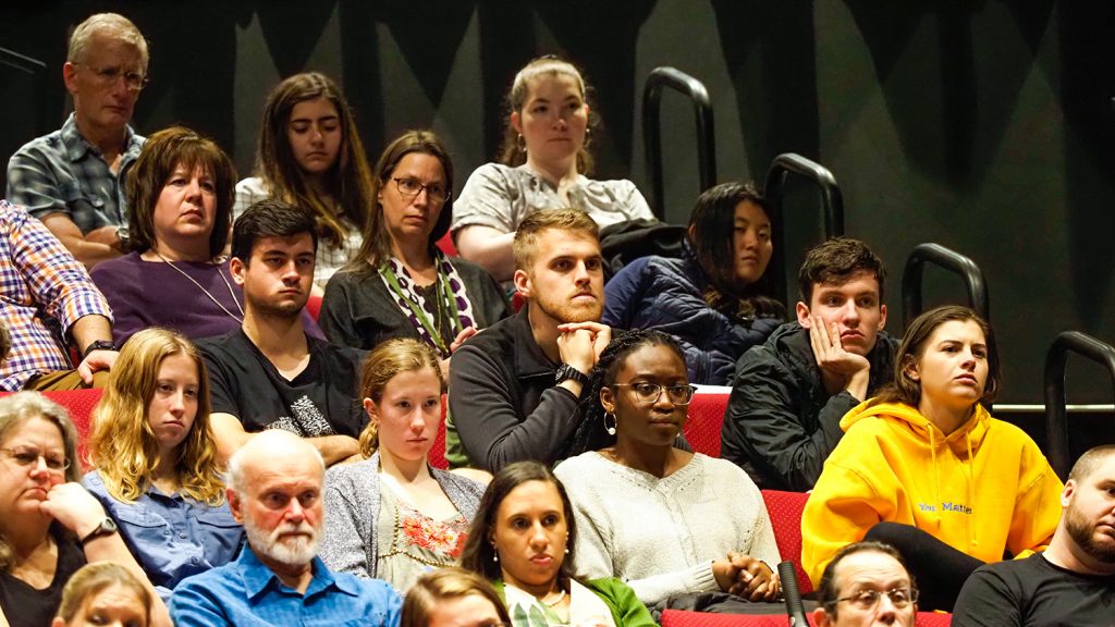 Audience members watch and listen to Dr. Kendi's presentation.