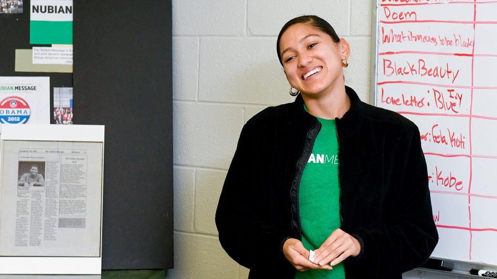 Editor-in-Chief Yesenia Jones smiles at a staff meeting for the Nubian Message.