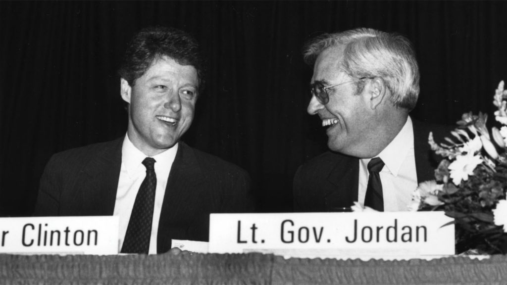 Bob Jordan at table with Bill Clinton.