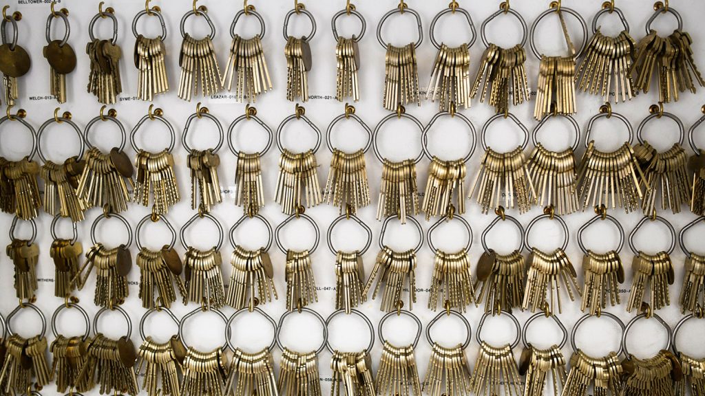 rows of keys hanging on a wall