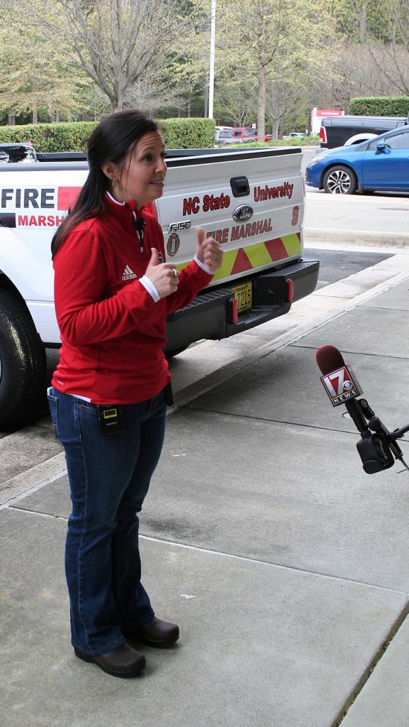 Amy Orders talks to the media at NC State.