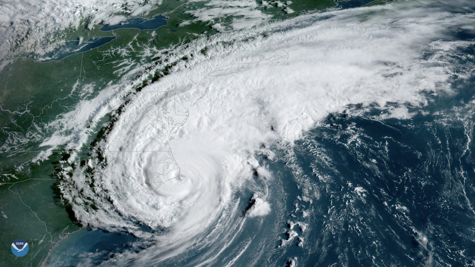 Hurricane Dorian appears as a swirl of white clouds over the US coast