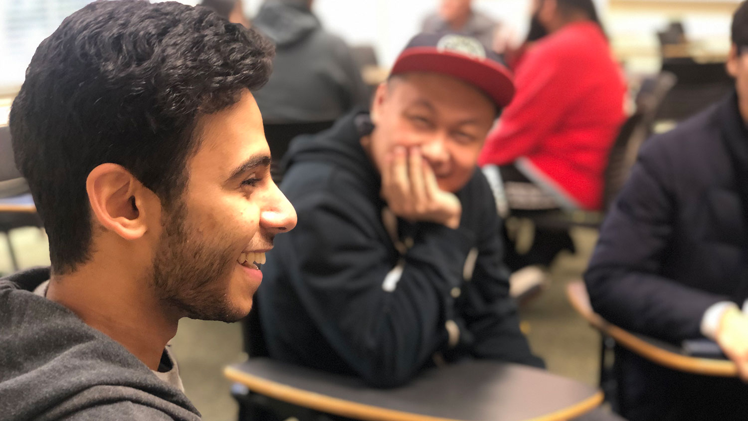 men sitting at desks