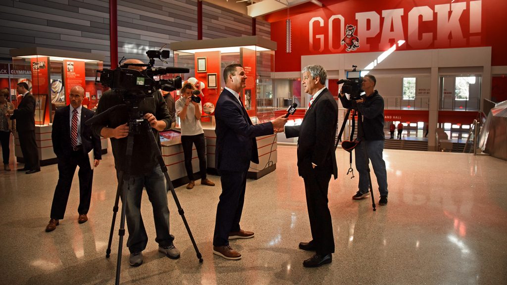 Corrigan answers a question from WRAL-TV sports director and NC State alumnus Jeff Gravley.