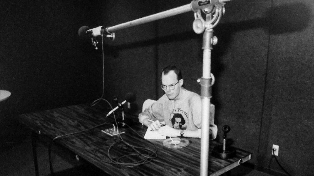 David Hunt preparing for a newscast in Studio D at KPFK, North Hollywood, California, in 1983. 