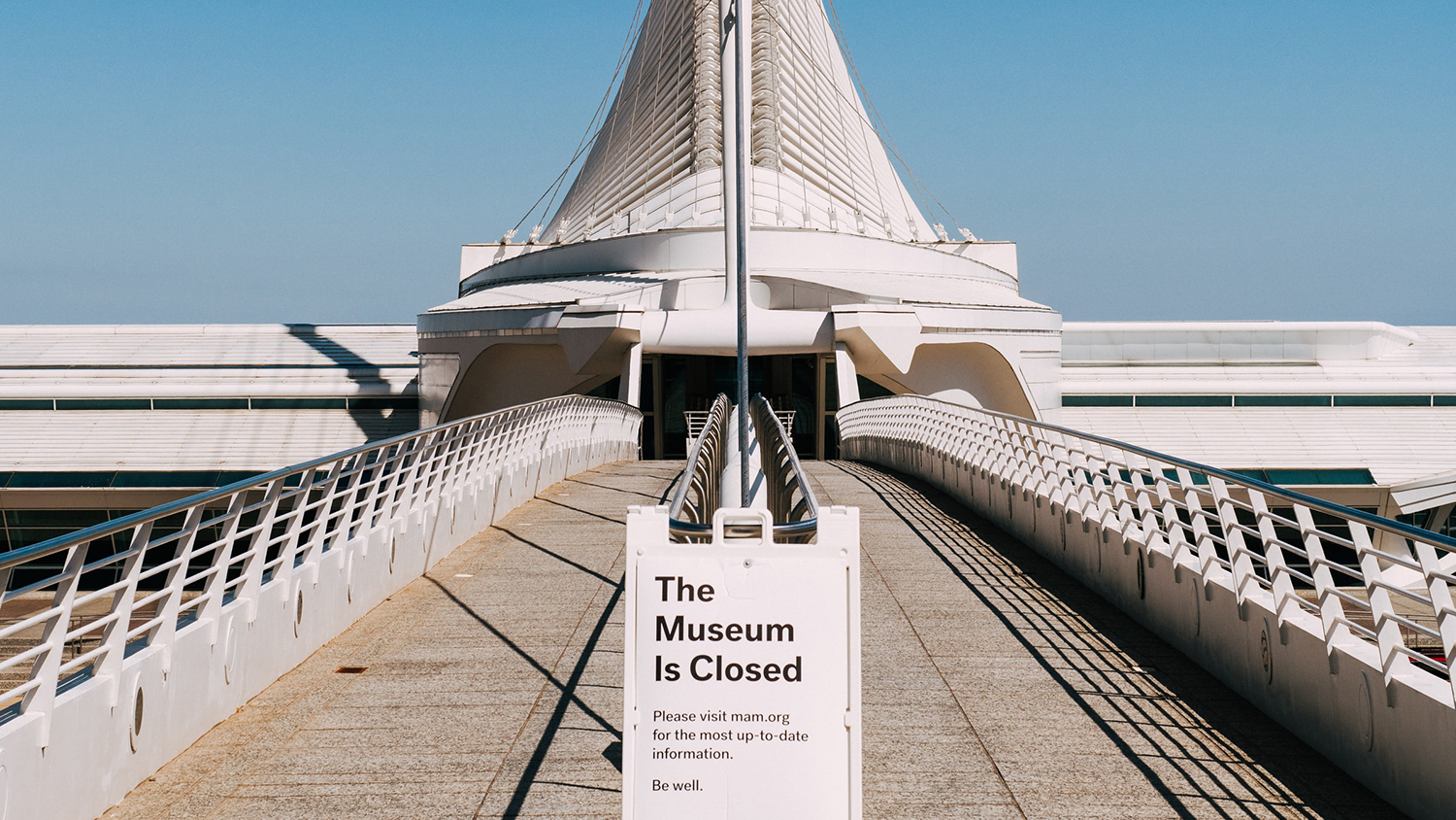 museum with closed sign in front