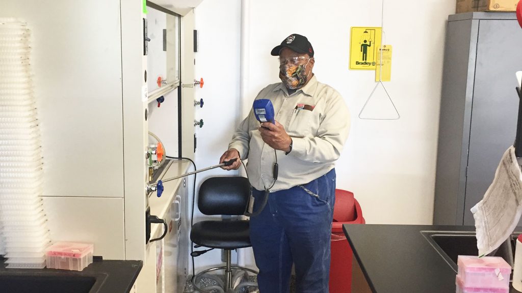 man testing lab equipment