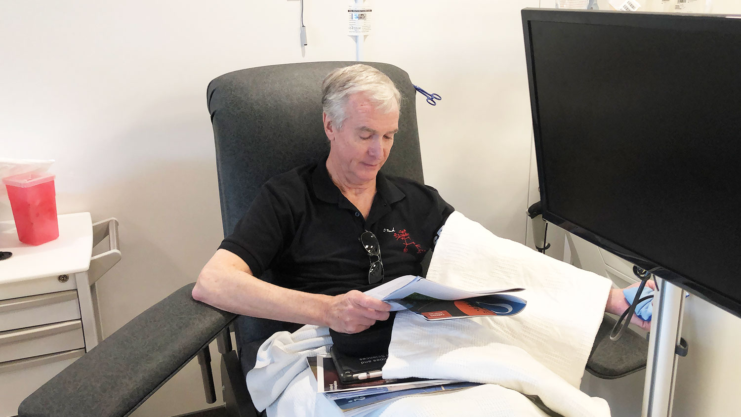 man sitting in chair donating platelets