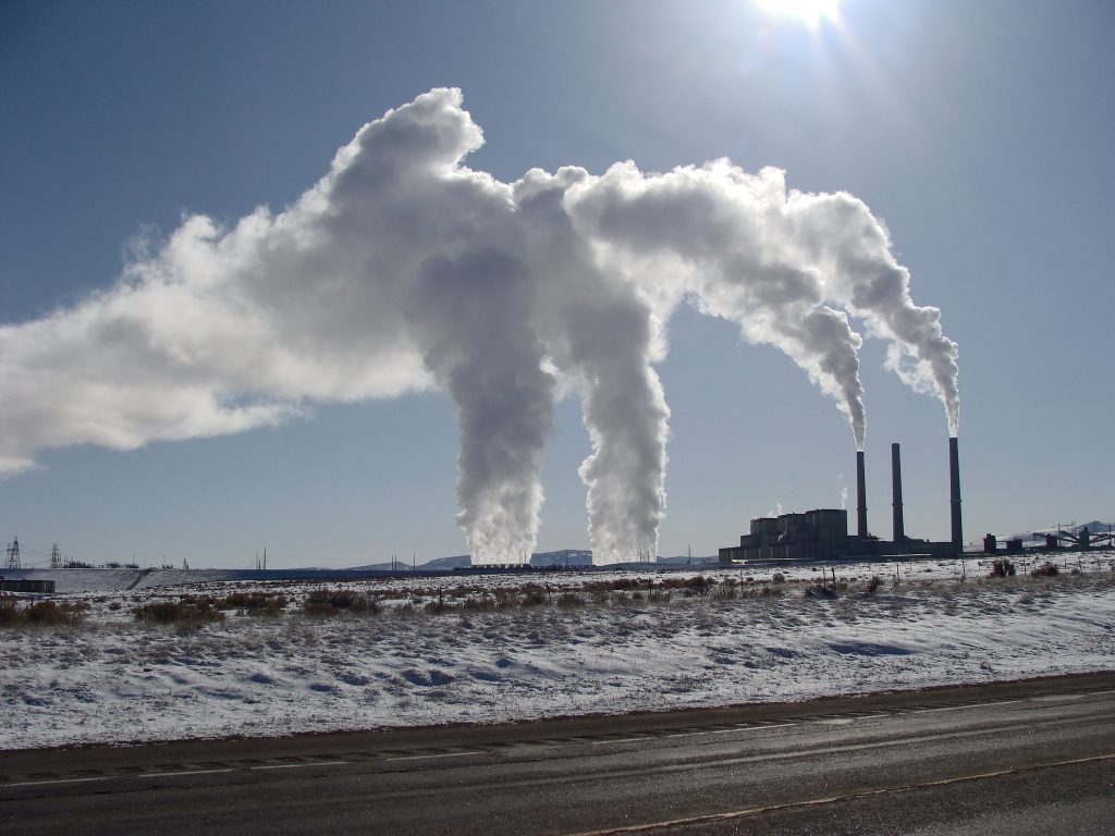 The image shows air pollution from a plant.