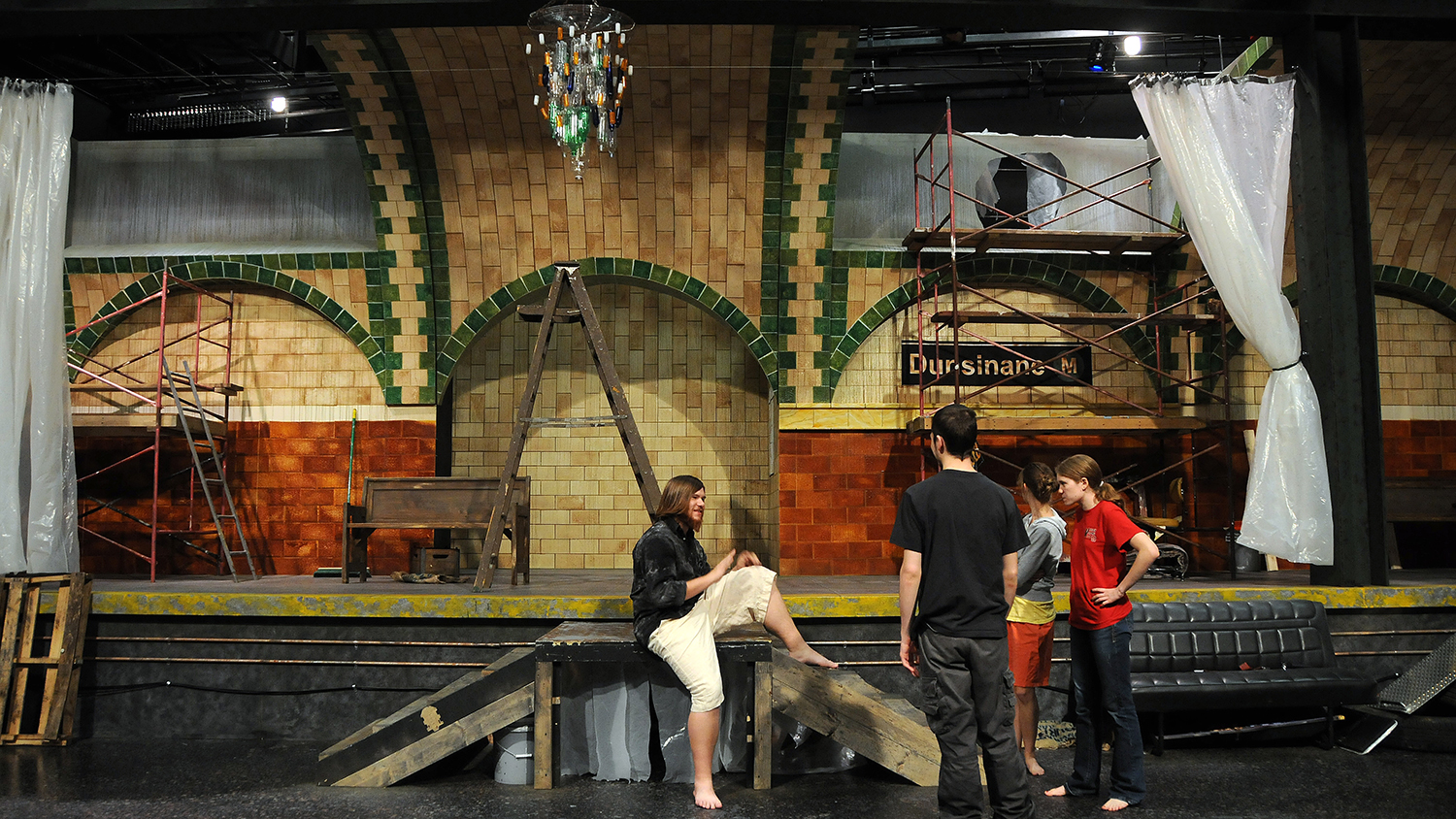 Student actors wait to rehearse a scene from "Hamlet" in Thompson Theatre.