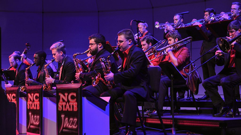 A jazz band plays on stage.