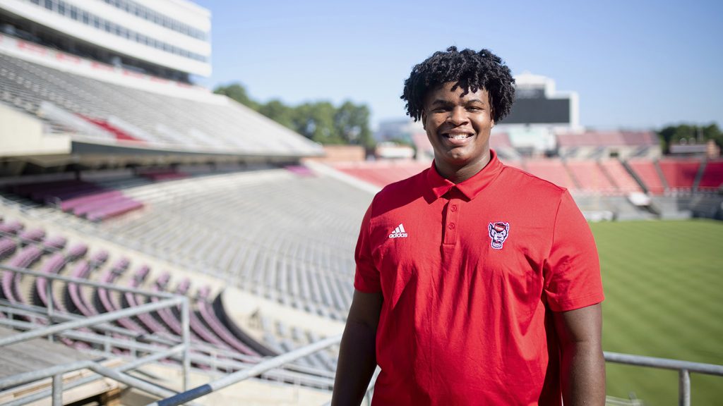 Anthony Carter, a first-year football player, stands for a portrait in Carter-Finley Stadium.