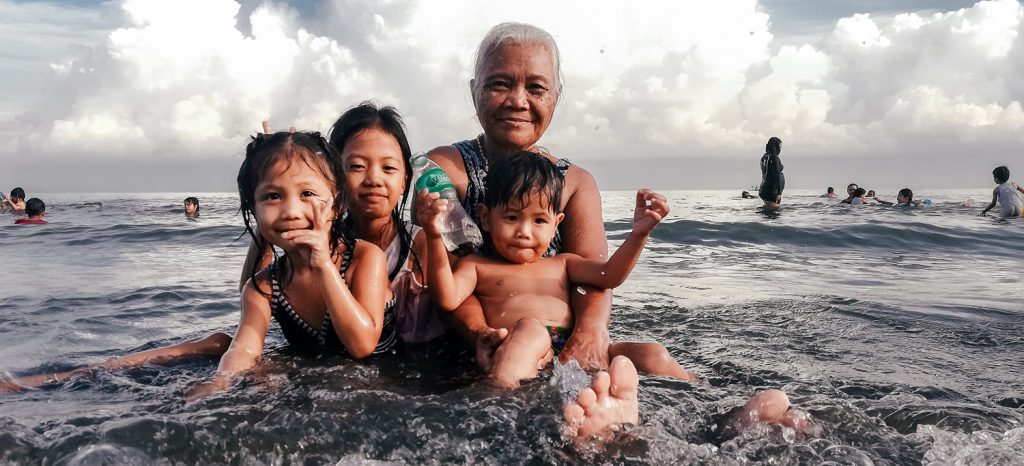 a family playing in the water