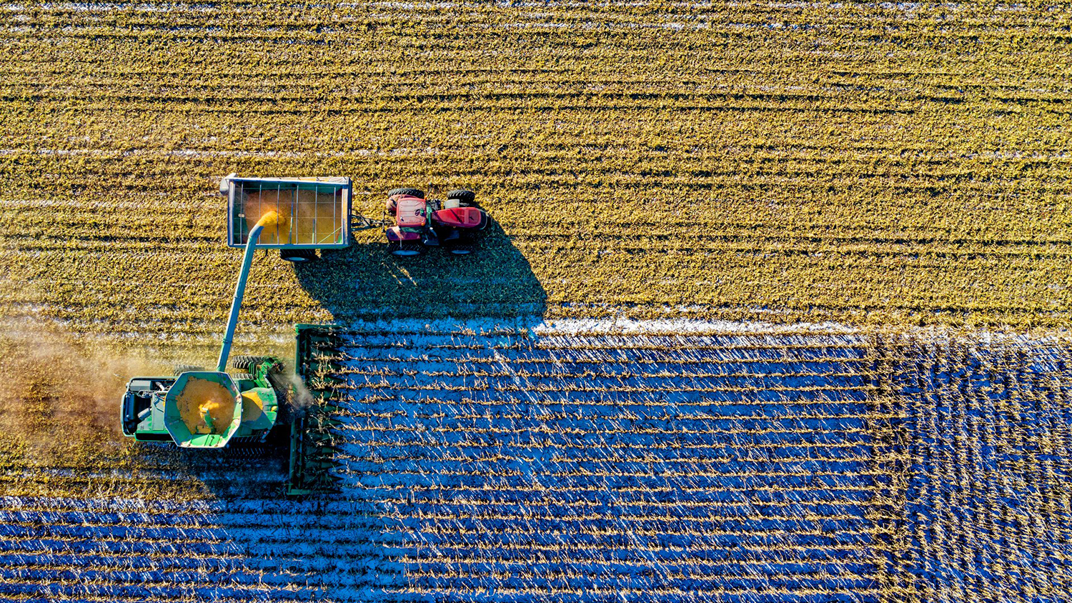 aerial view of a combine harvester in a field