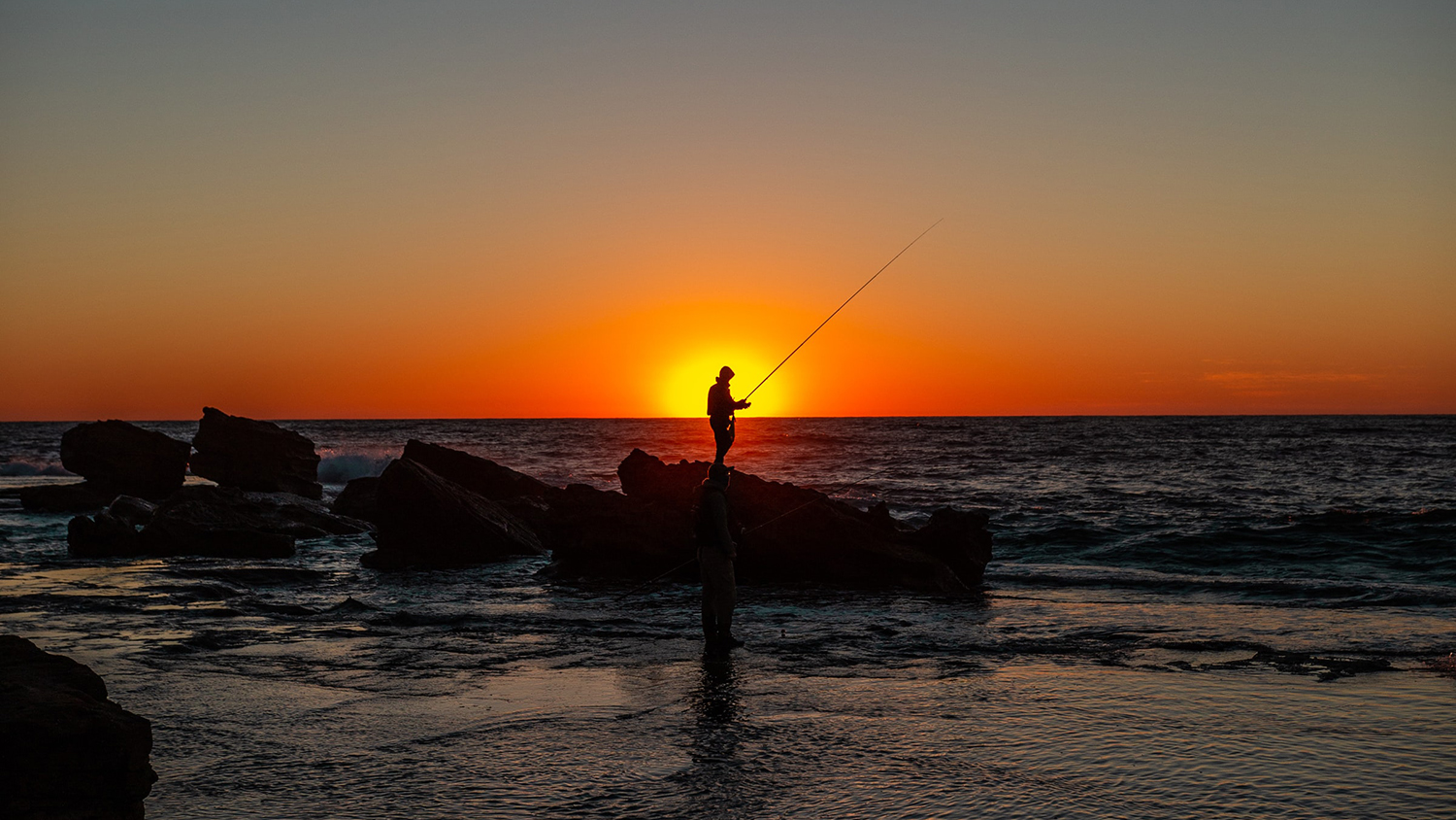 an angler fishing on the shore