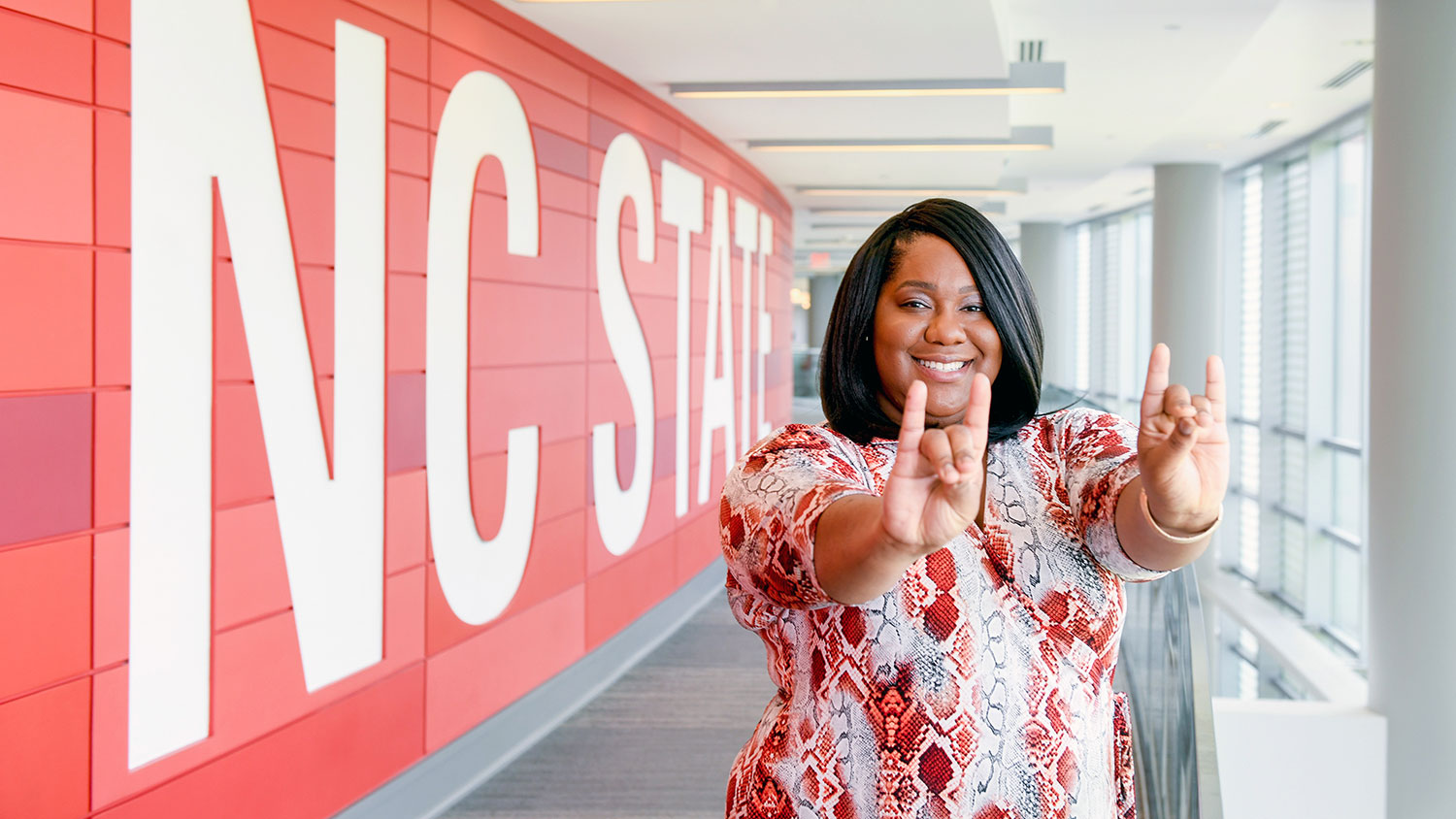 Chernelle Jones making wolf ears symbol with her hands