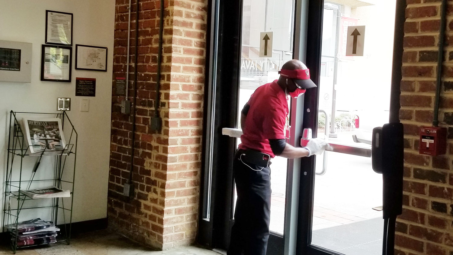 housekeeper cleaning door