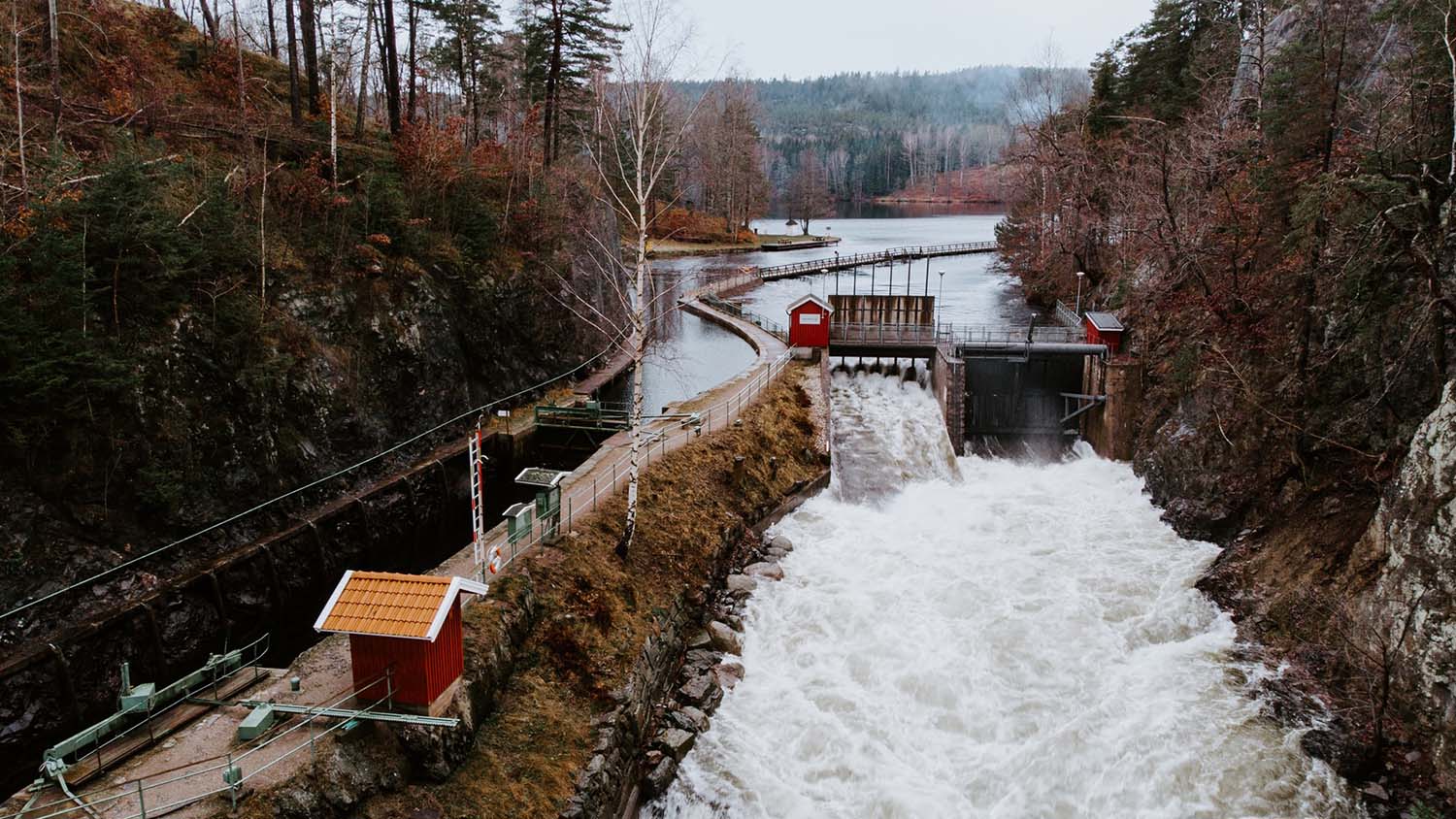 dam draws water from a river to supply a power plant