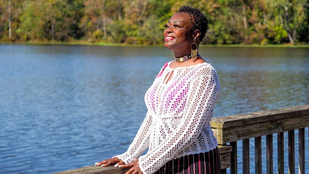 woman standing on dock at Lake Raleigh