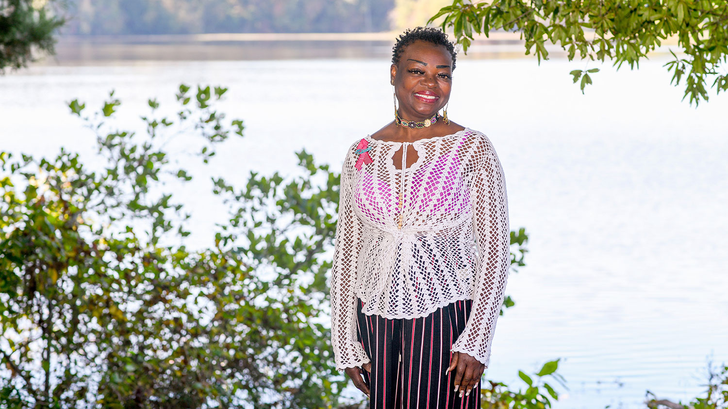 woman standing by Lake Raleigh