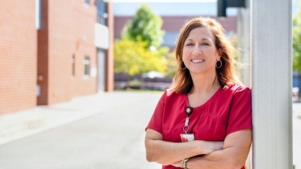 Lisa Dolan outside the Student Health Services building on NC State's campus