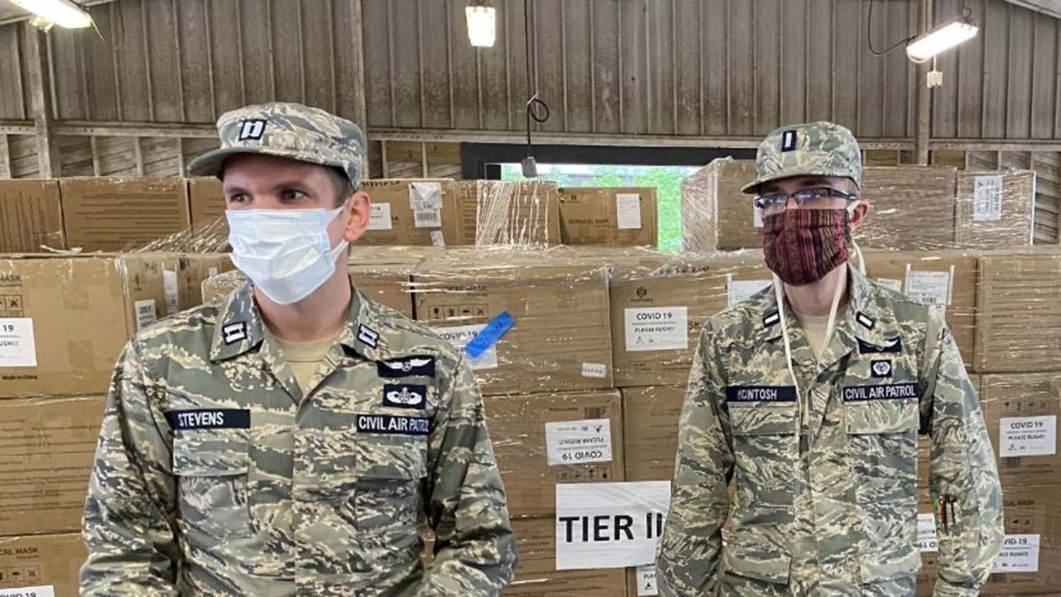 two men in Civil Air Patrol uniforms at a PPE distribution site in NC