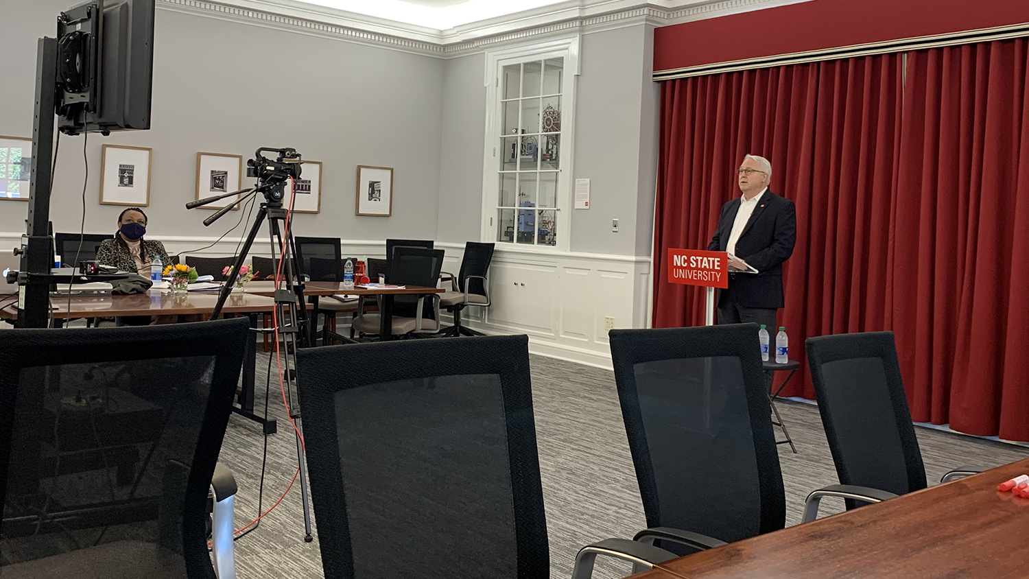 Chancellor Woodson in front of a camera at the virtual summit.