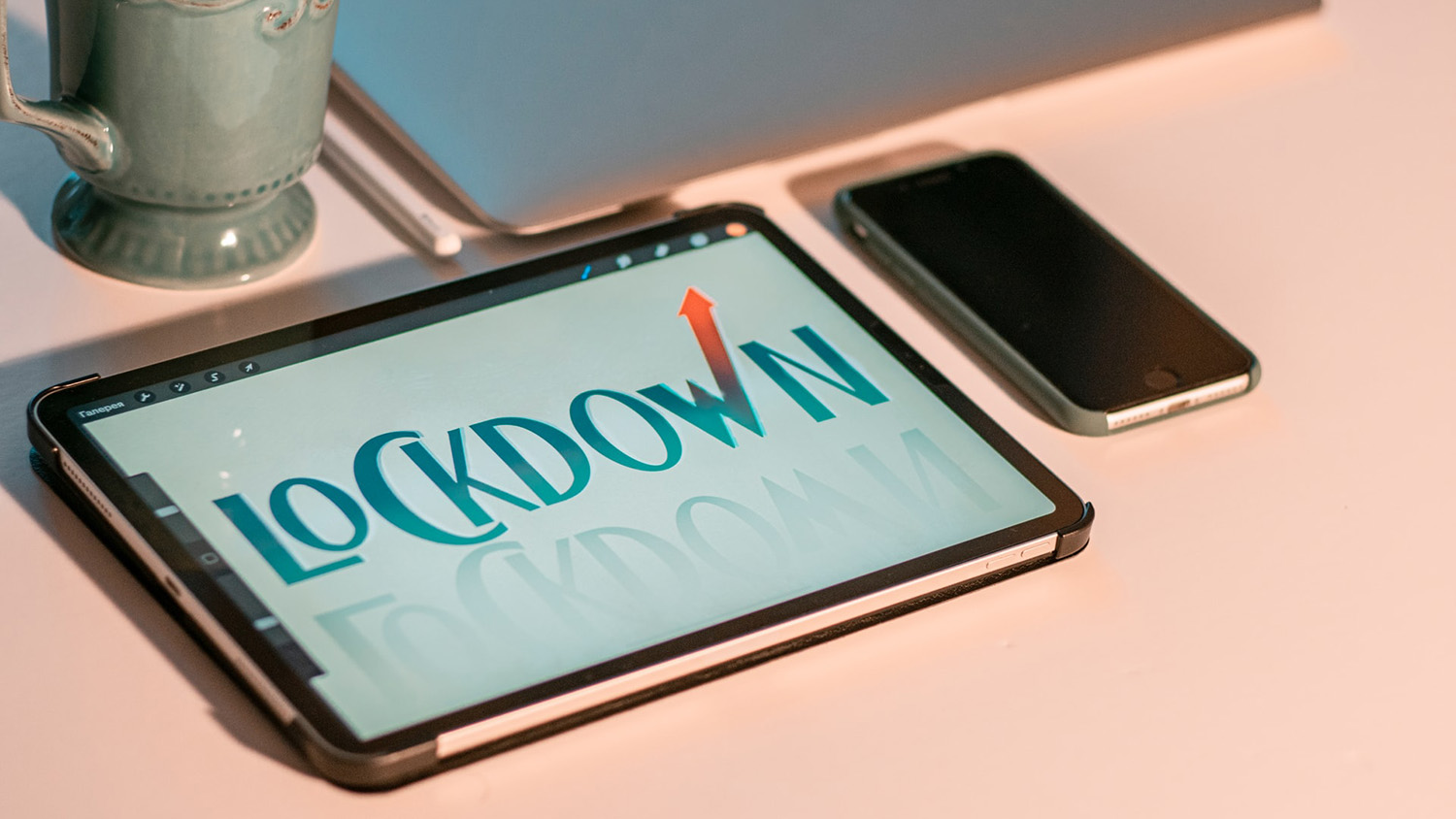 tablet and cell phone on a table