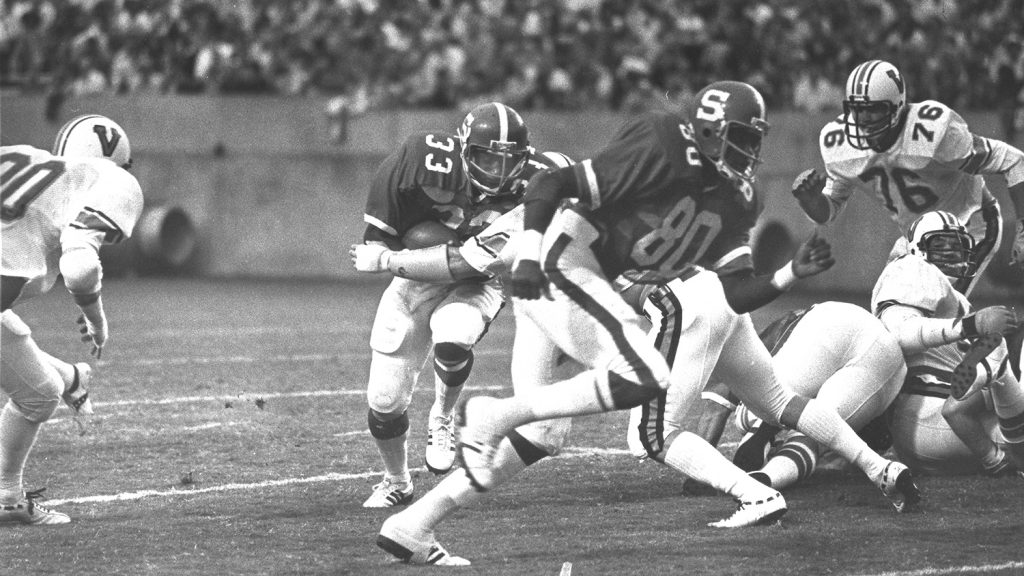 Billy Ray Vickers evades a tackle in a technician photo from the 1970s.