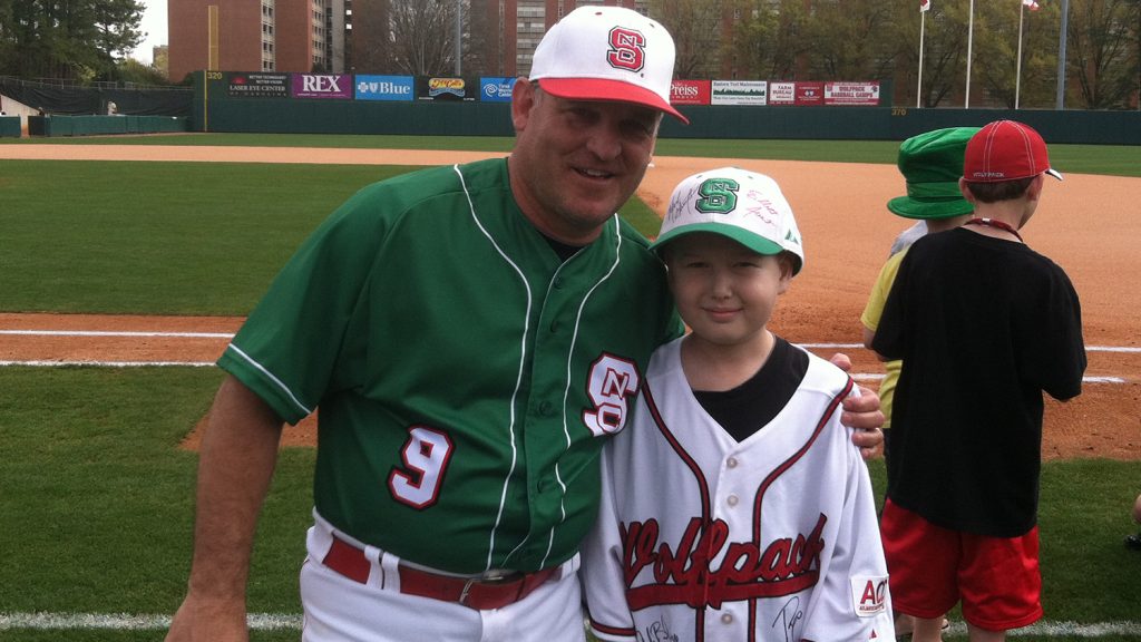 McKinion and head coach Elliott Avent on the field.