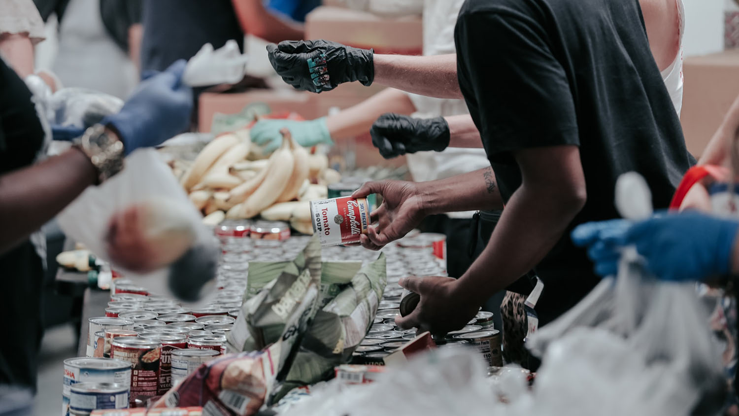 volunteers work at a food pantry