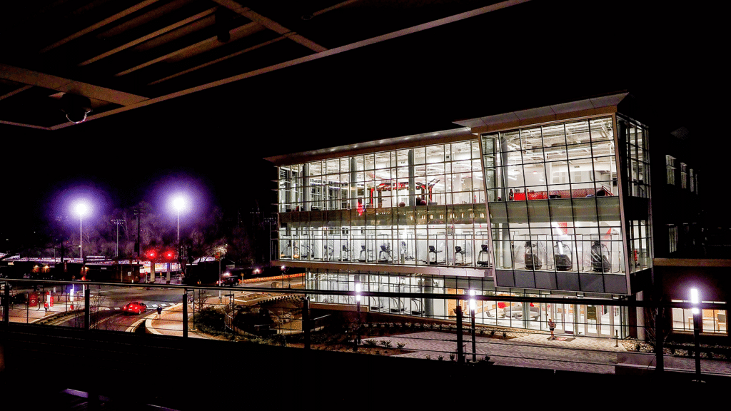 The exterior of NC State's Wellness and Recreation Center at night.