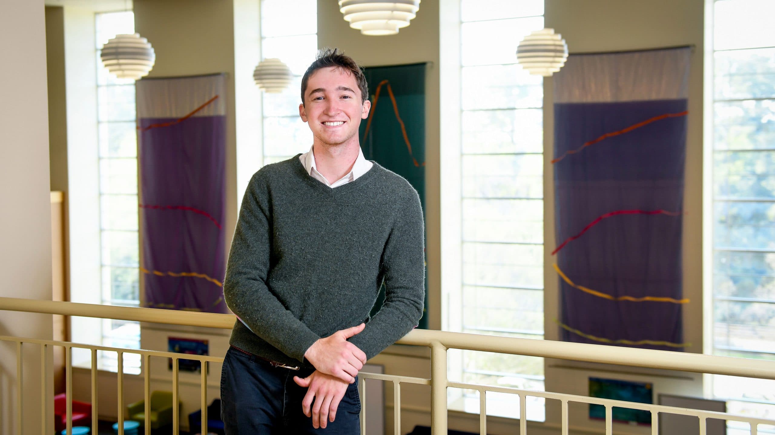 NC State Goldwater Scholar Jack Featherstone leans against a railing.