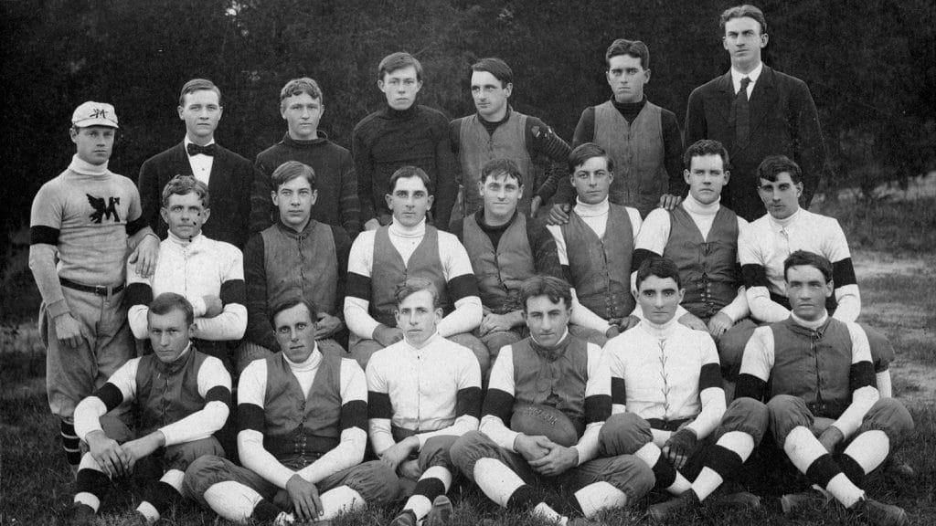 In a varsity team photo in 1907, Thompson is seated in the front row with the football. Sykes is the next player to the right.