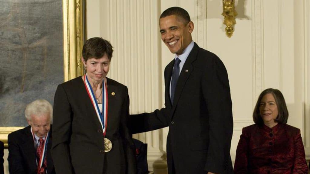 Marye Anne Fox standing next to President Obama at White House ceremony.