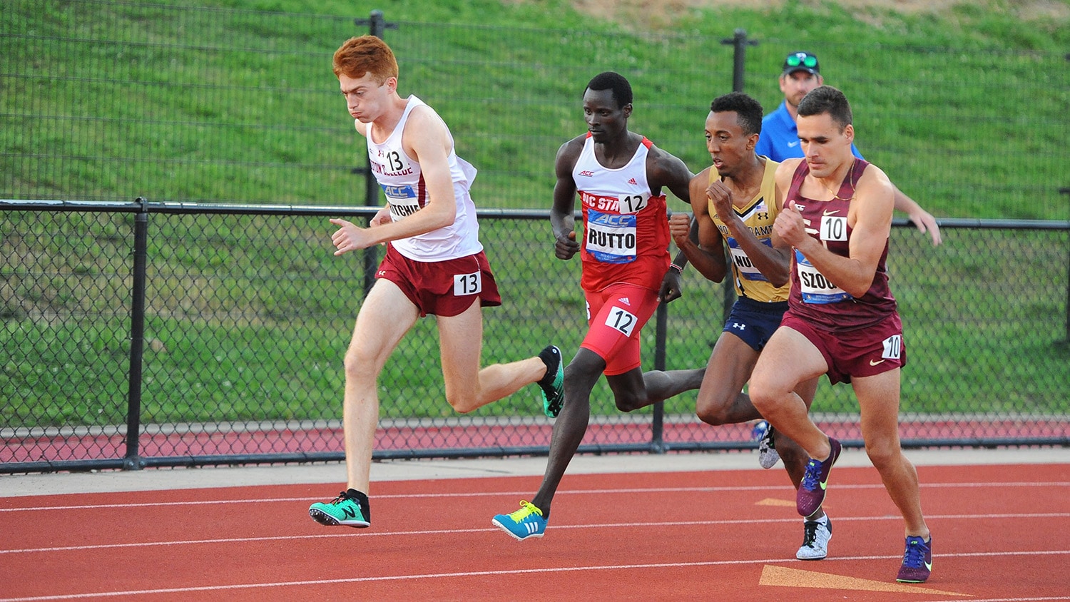 Edwin Rutto in a pack of runners nearing the finish line.