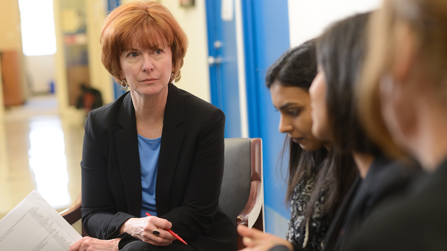 Mary Haskett talking with several students at NC State.