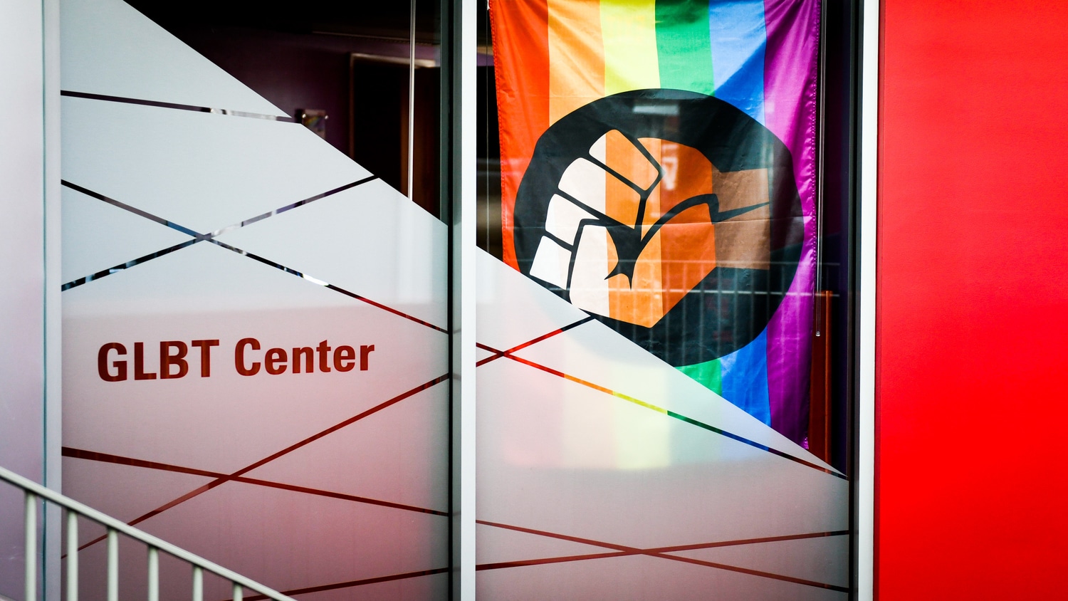 the entrance to the GLBT center adorned with a rainbow flag