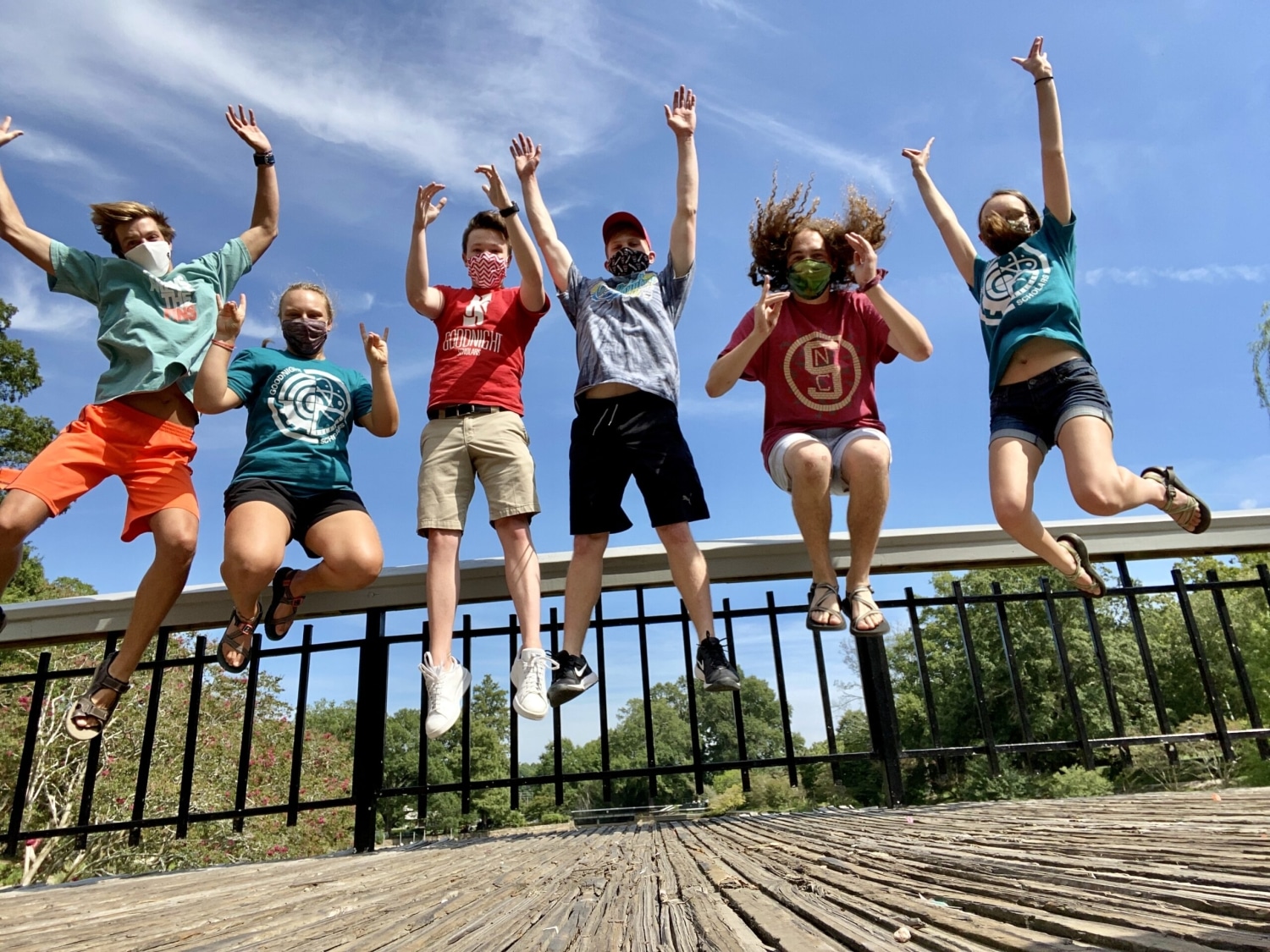 group of students jumping in the air